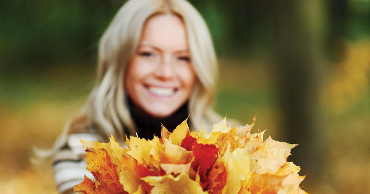02h26382 woman holding leaves web