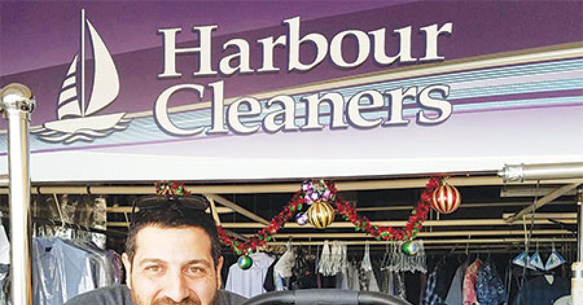harbour cleaners saro semerican with his infant son web