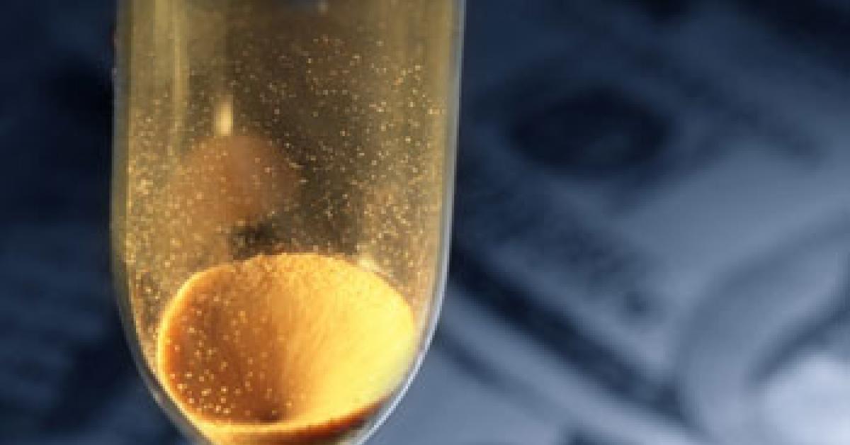 hour glass with money in background