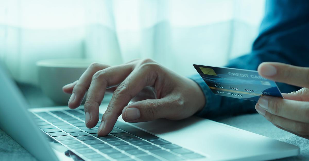 Man using credit care for an online digital payment