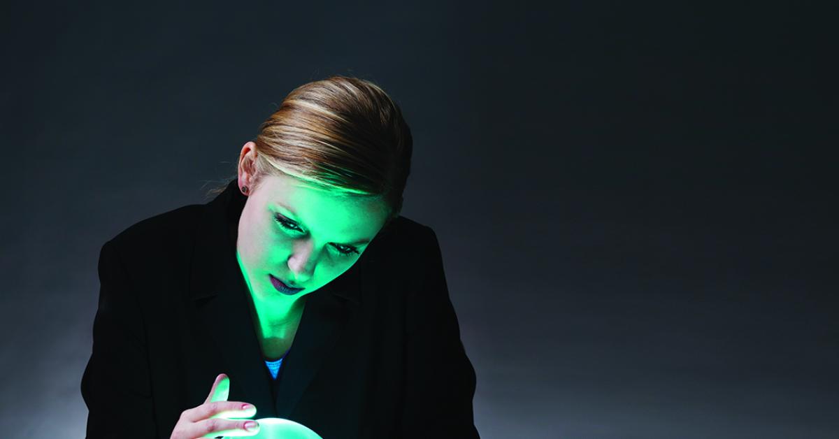 Woman looking into a crystal ball