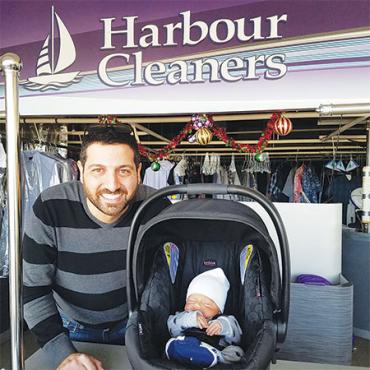 harbour cleaners saro semerican with his infant son web
