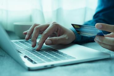 Man using credit care for an online digital payment