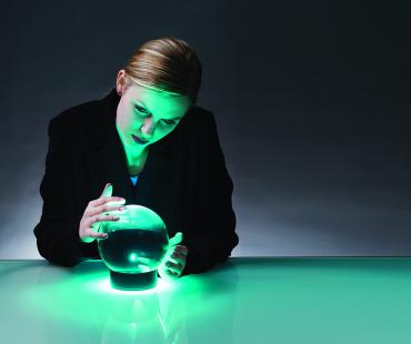 Woman looking into a crystal ball