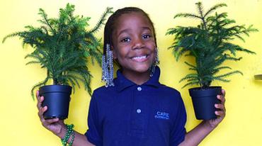 oxxo communities bloom cute little girl with plants image2 web